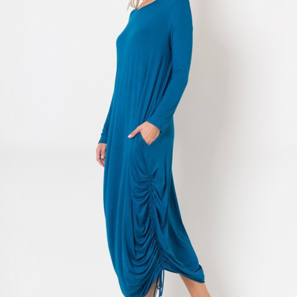 Long sleeve teal dress with drawstring sides.